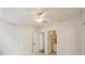 Bedroom featuring ceiling fan and access to hall bathroom at 701 Mirror Lake N Dr # 212, St Petersburg, FL 33701