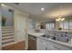 Bright kitchen with white cabinets and stainless steel appliances at 9247 Jakes Path, Largo, FL 33771
