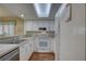 Bright kitchen with white cabinets and stainless steel appliances at 9247 Jakes Path, Largo, FL 33771