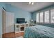 Bedroom with queen bed and built-in shelving at 9247 Jakes Path, Largo, FL 33771