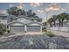 Two-car attached garage with gray doors at 9247 Jakes Path, Largo, FL 33771