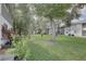 Landscaped community grounds with lush greenery and mature trees at 9247 Jakes Path, Largo, FL 33771