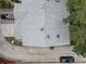 Aerial view of a townhouse showing gray roof and parking area at 9247 Jakes Path, Largo, FL 33771