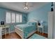 Bedroom with queen bed and window seat at 9247 Jakes Path, Largo, FL 33771