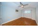 Simple bedroom with light walls and wood flooring at 315 Princess St, Clearwater, FL 33755