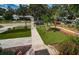 Landscaped front yard with artificial turf and walkway leading to the house entrance at 315 Princess St, Clearwater, FL 33755