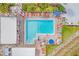 Aerial view of refreshing pool with surrounding lounge chairs and patio umbrellas at 2506 N Rocky Point Dr # 274, Tampa, FL 33607
