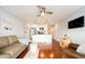 Open living room with hardwood floors and kitchen island at 2506 N Rocky Point Dr # 274, Tampa, FL 33607