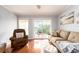 Living room with sliding doors leading to a balcony at 2506 N Rocky Point Dr # 274, Tampa, FL 33607