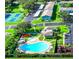 Aerial view of community featuring pool, tennis courts, playground, parking and buildings with well maintained lawn at 182 114Th Ne Ter # 182, St Petersburg, FL 33716