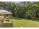 Private backyard with open space and mature trees at 1938 Fiesta Ridge Ct, Tampa, FL 33604