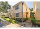 Exterior view of townhome with landscaping and walkway at 1938 Fiesta Ridge Ct, Tampa, FL 33604