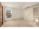 Bedroom with carpet, built-in shelving, and closet at 3045 Kevlyn Ct, Safety Harbor, FL 34695