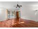 Spacious bedroom with hardwood floors and access to the pool at 3045 Kevlyn Ct, Safety Harbor, FL 34695