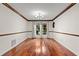 Elegant dining room features hardwood floors and a chandelier at 3045 Kevlyn Ct, Safety Harbor, FL 34695