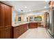 Spacious kitchen boasts granite countertops, stainless steel appliances, and an island at 3045 Kevlyn Ct, Safety Harbor, FL 34695