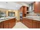Modern kitchen with granite countertops, stainless steel appliances, and breakfast bar at 3045 Kevlyn Ct, Safety Harbor, FL 34695