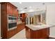 Kitchen with granite countertops, stainless steel appliances and an island at 3045 Kevlyn Ct, Safety Harbor, FL 34695