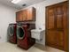 Laundry room with washer, dryer, and cabinets at 3045 Kevlyn Ct, Safety Harbor, FL 34695