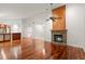 Living room with hardwood floors, fireplace, and vaulted ceiling at 3045 Kevlyn Ct, Safety Harbor, FL 34695