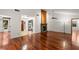 Bright living room features hardwood floors and a cozy fireplace at 3045 Kevlyn Ct, Safety Harbor, FL 34695