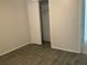 Bright bedroom with a closet and easy access to the bathroom at 3455 Countryside Blvd # 15, Clearwater, FL 33761
