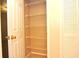 This is a walk in closet with white shelves at 3455 Countryside Blvd # 15, Clearwater, FL 33761
