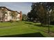 Landscaped grounds showcasing a well-maintained condo building and a peaceful neighborhood at 3455 Countryside Blvd # 15, Clearwater, FL 33761