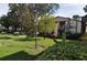 Charming condo building with manicured lawn, mature trees, and inviting curb appeal at 3455 Countryside Blvd # 15, Clearwater, FL 33761