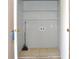 This laundry room has storage shelves and tile flooring at 3455 Countryside Blvd # 15, Clearwater, FL 33761