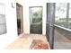 A screened patio with tile flooring and a rug at 3455 Countryside Blvd # 15, Clearwater, FL 33761