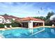 Beautiful community pool with lounge chairs and a shaded recreation area at 3455 Countryside Blvd # 15, Clearwater, FL 33761