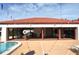 Community pool house with ample seating and a large red tile roof at 3455 Countryside Blvd # 15, Clearwater, FL 33761