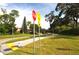 Scenic street view with bike lane and well-maintained landscaping at 3455 Countryside Blvd # 15, Clearwater, FL 33761