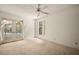 Bedroom with pool view, carpet flooring, and a ceiling fan at 3045 Kevlyn Ct, Safety Harbor, FL 34695