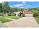 Spacious house with a large driveway and yard at 3045 Kevlyn Ct, Safety Harbor, FL 34695