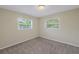 Well-lit bedroom with neutral walls and carpet flooring at 6195 28Th N Ave, St Petersburg, FL 33710