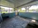 Screened patio with concrete flooring and built-in counter at 182 114Th Ne Ter # 182, St Petersburg, FL 33716