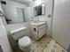 Clean bathroom with a toilet, sink, and vanity at 182 114Th Ne Ter # 182, St Petersburg, FL 33716