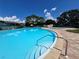 Community pool with spa and lounge chairs at 182 114Th Ne Ter # 182, St Petersburg, FL 33716