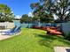 Relaxing pool deck with lounge chairs and grilling area at 182 114Th Ne Ter # 182, St Petersburg, FL 33716