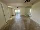 Spacious living room with large mirror and access to patio at 182 114Th Ne Ter # 182, St Petersburg, FL 33716