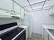 Functional kitchen with white appliances and ample cabinet space at 400 N Bayshore Blvd # 104, Clearwater, FL 33759