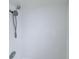 Clean, white tiled shower with modern showerhead at 400 N Bayshore Blvd # 104, Clearwater, FL 33759