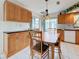 Bright dining room features tile flooring, wood cabinetry, and large windows at 7839 39Th N Ter, St Petersburg, FL 33709