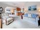 Spacious living room flows to the dining area with bright interior and comfortable seating at 7839 39Th N Ter, St Petersburg, FL 33709