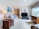 Cozy living room with plush carpet, comfortable seating and natural light at 7839 39Th N Ter, St Petersburg, FL 33709