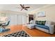 Living room featuring hardwood floors and a comfy couch at 11837 Wildeflower Pl, Temple Terrace, FL 33617