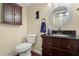 Well-appointed bathroom with dark vanity and updated fixtures at 11837 Wildeflower Pl, Temple Terrace, FL 33617