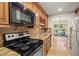 Kitchen with granite countertops and stainless steel appliances at 11837 Wildeflower Pl, Temple Terrace, FL 33617